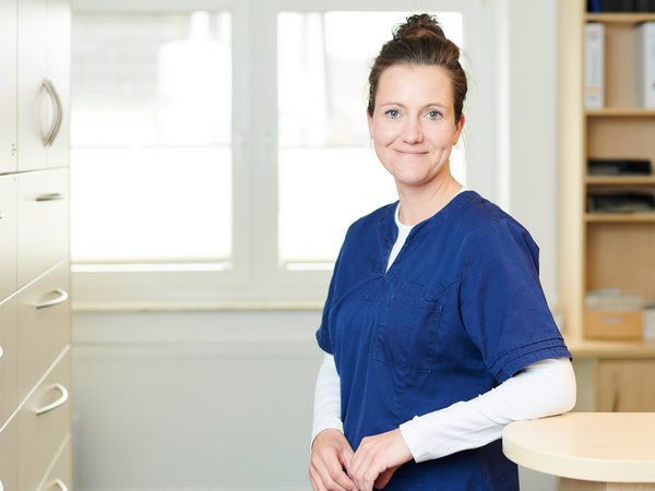 Portrait of Yvonne Spanier at the reception area, smiling